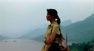 Photo of a young woman in a Chinese landscape.