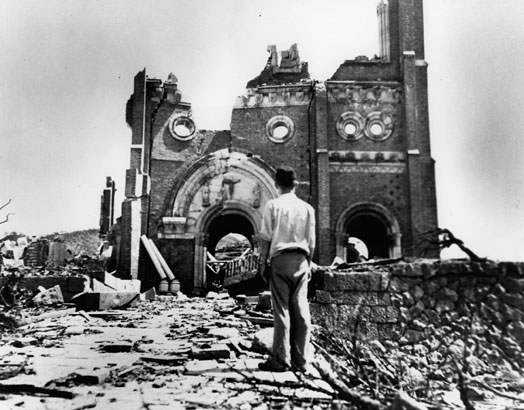 This powerful photograph, Redress, features a man by the remains of a Cathedral in Urakami, left after the nuclear bomb in 1945.