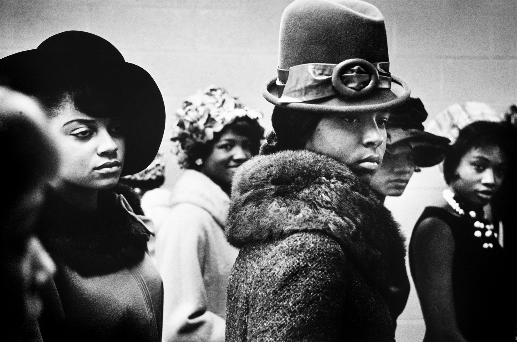 Photograph of African American women in the Harlem Fashion Show in Harlem in 1963, taken by Leonard Freed