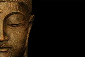 Image of the head of stone Buddha statue.
