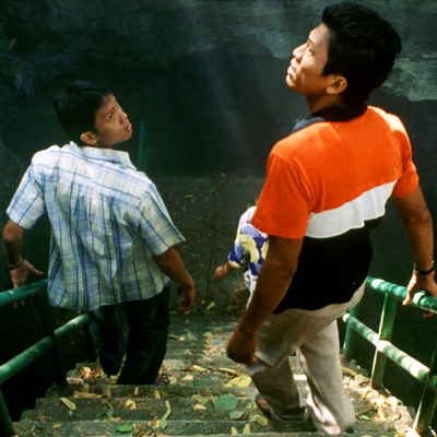 Tropical Malady Film Still (Male Couple Descending Outdoor Staircase)