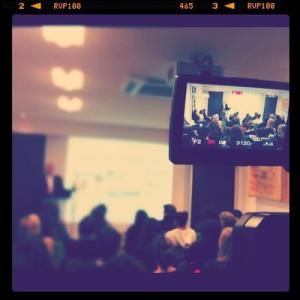 Photo of a student filming a lecture.