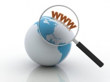 A magnifying glass on a globe, displaying 'WWW'