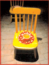 Image of a brochure cover with a very tiny yellow chair.