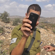IDF soldier filming back B’Tselem volunteer Iyad Hadad, © 2012 B’Tselem