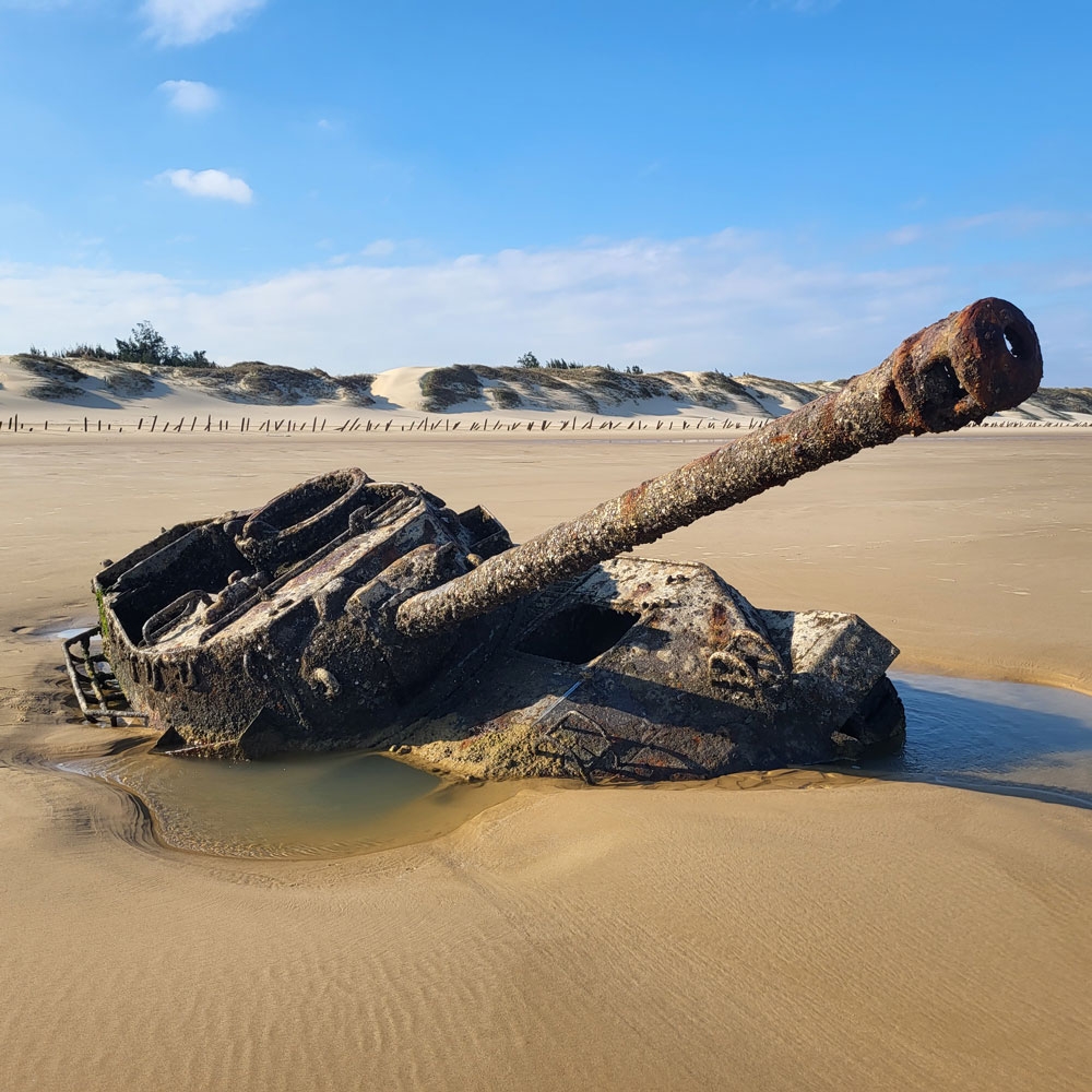 Tank Half Buried in Sand Photo