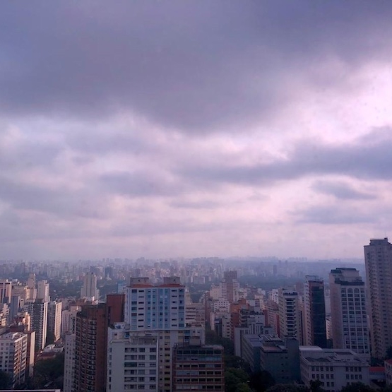 Latin American Dense City Skyline with Cloud Cover