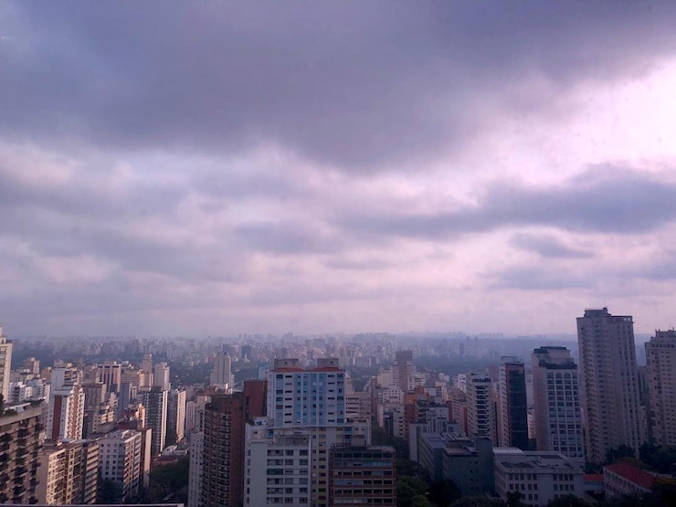 Latin American Dense City Skyline with Cloud Cover